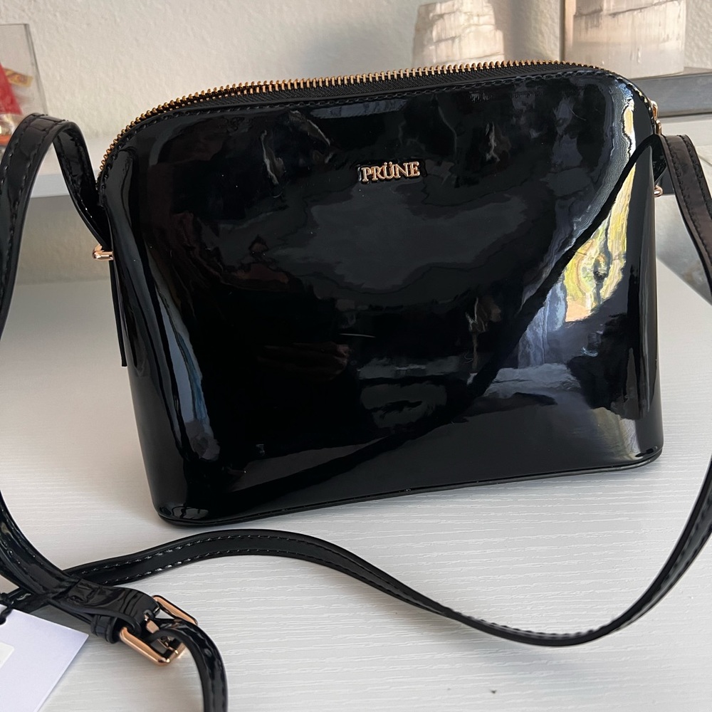 Brand new prune patent leather bag